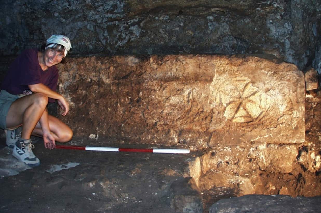 An Archaeologist performing excavations.