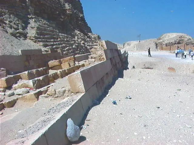 Not all of the casing stones are missing. A few of the casing stones from the lowest course can be seen to around the base of the Great Pyramid. Image Credit.