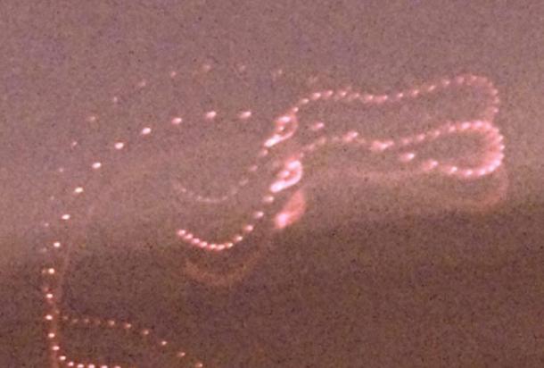 Photograph of an ITE-2 displaying intelligent movement. Dr Santilli states that the entity consists of lights of different colors that are pulsating and move synchronously according to a complex trajectory during the 15 seconds of exposure, including a point in which motion stopped for a few seconds, to resume thereafter. 