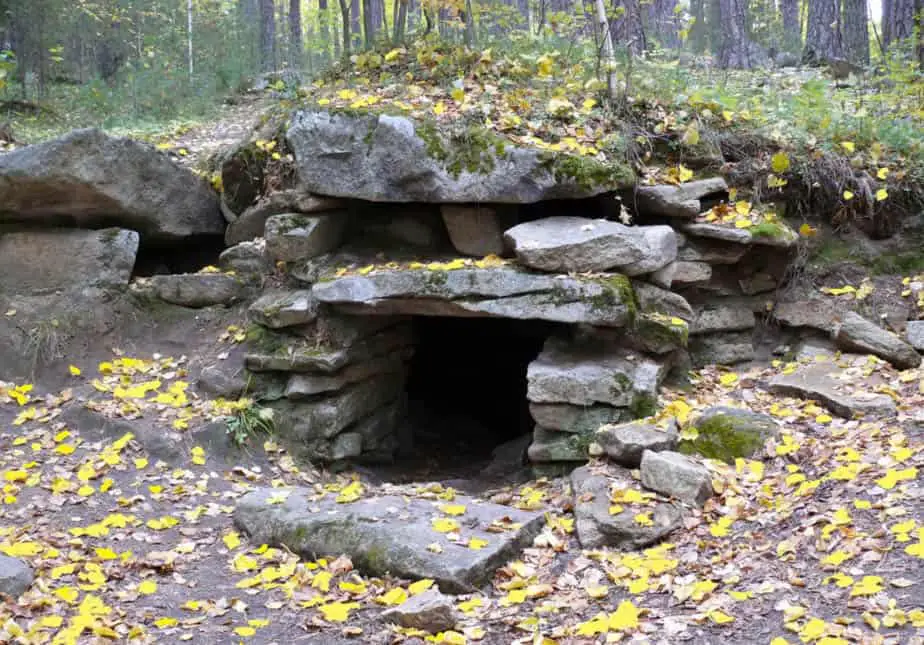 An image of Megalith Structure number 2, it was carved into a rocky slope with a mound structure covering it Image Credit