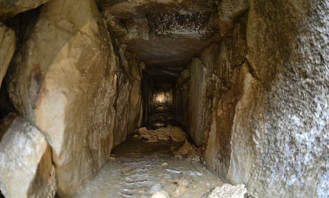 The tunnel, which connects to another, is made of stone and is about 2ft (60cm) wide and tall. 